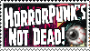 Stamp bold font reads - horrorpunk's not dead - eye floating in corner